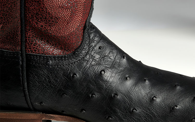 close up of black leather boot